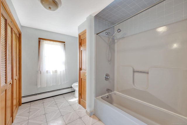 full bathroom with a closet, a baseboard heating unit, toilet, and shower / washtub combination