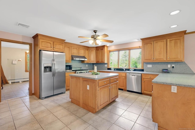 kitchen featuring baseboard heating, stainless steel appliances, tasteful backsplash, under cabinet range hood, and visible vents