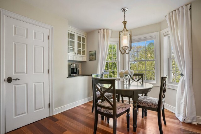 1803 Revere Rd, Danbury, CT 06811 - dining room with baseboards and dark wood-type flooring