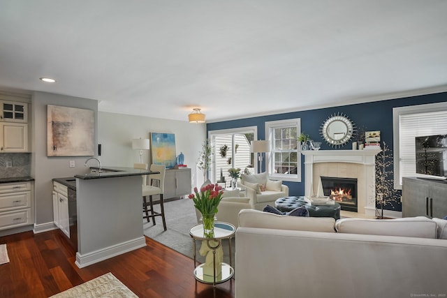 1803 Revere Rd, Danbury, CT 06811 - living area featuring crown molding, baseboards, dark wood-type flooring, recessed lighting, and a tile fireplace