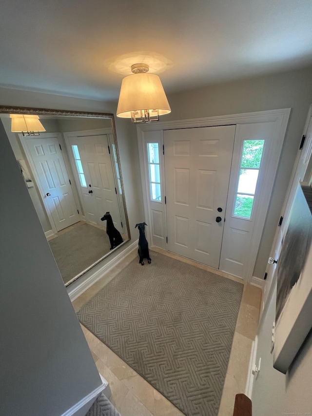 1803 Revere Rd, Danbury, CT 06811 - entrance foyer featuring plenty of natural light, baseboards, and a notable chandelier