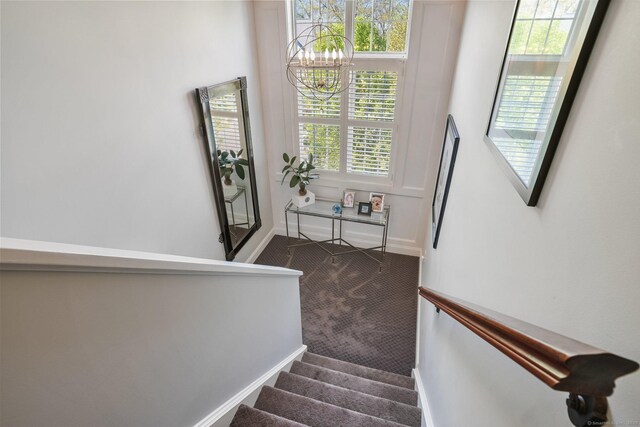 1803 Revere Rd, Danbury, CT 06811 - stairs featuring baseboards, carpet flooring, and a notable chandelier