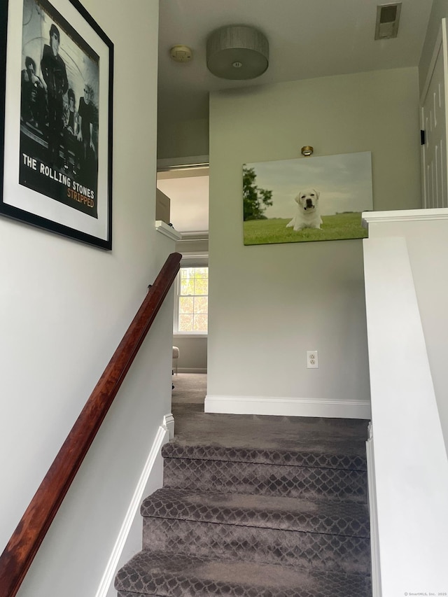 1803 Revere Rd, Danbury, CT 06811 - stairway featuring baseboards, wood finished floors, and visible vents