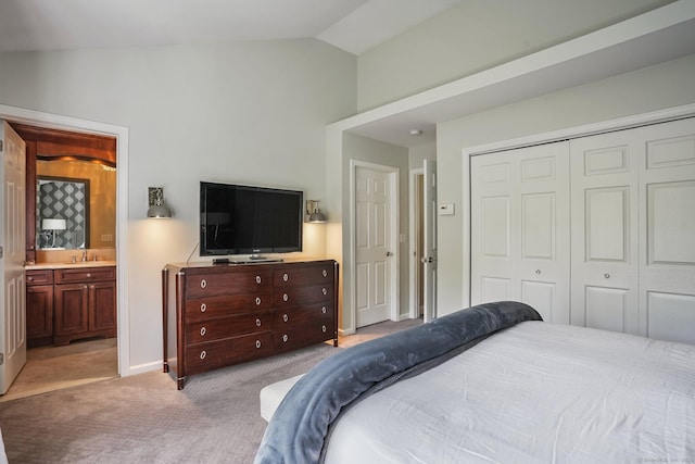 1803 Revere Rd, Danbury, CT 06811 - bedroom featuring connected bathroom, light colored carpet, a sink, lofted ceiling, and a closet