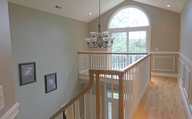 46 Brookfield Rd, Seymour, CT 06483 - stairs featuring a chandelier, wood finished floors, a wainscoted wall, lofted ceiling, and a decorative wall