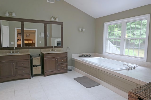 46 Brookfield Rd, Seymour, CT 06483 - bathroom with lofted ceiling, two vanities, a bath, and ensuite bathroom