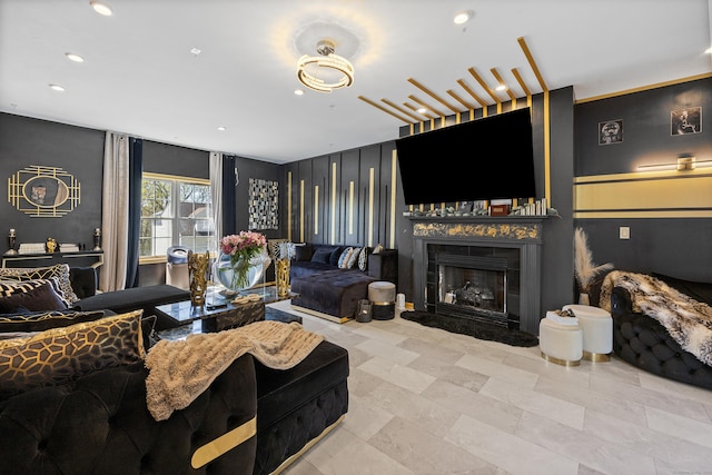 living room with recessed lighting and a fireplace