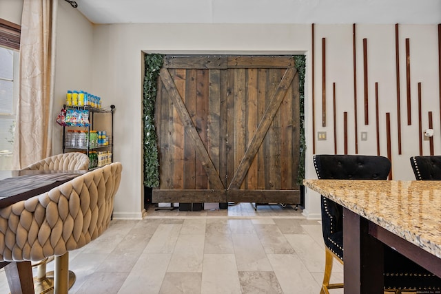interior space featuring baseboards