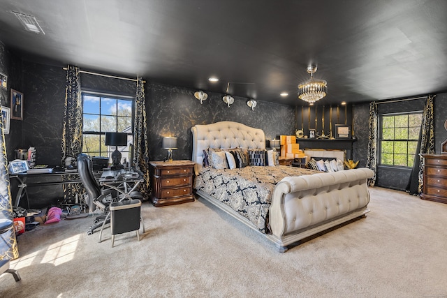bedroom featuring carpet floors, visible vents, a notable chandelier, and wallpapered walls