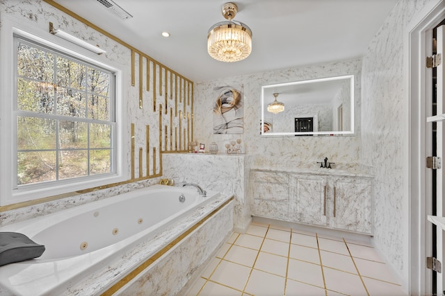bathroom featuring a healthy amount of sunlight, tile patterned floors, a chandelier, and visible vents