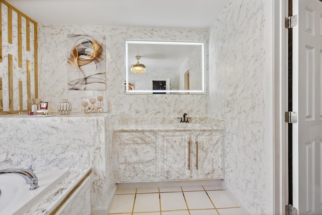 full bath featuring a bath, tile patterned flooring, and vanity