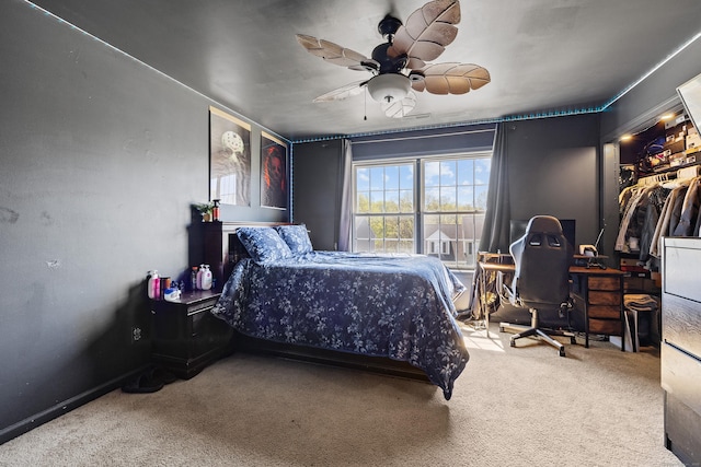 carpeted bedroom with a ceiling fan