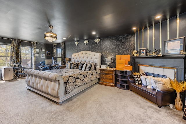 bedroom with carpet floors, recessed lighting, and a tile fireplace
