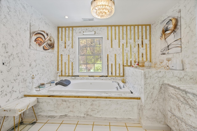 bathroom featuring a garden tub, visible vents, and an inviting chandelier