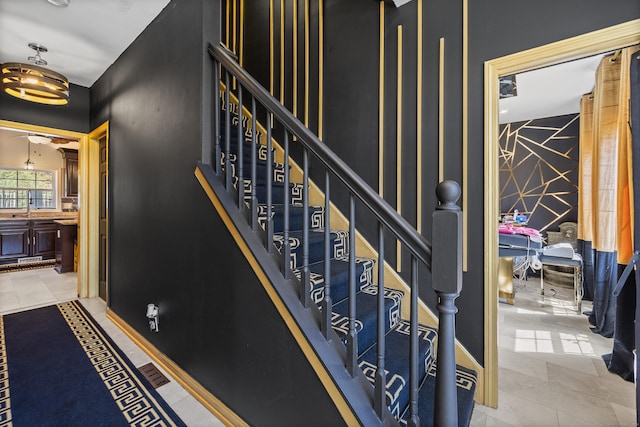 stairs featuring baseboards