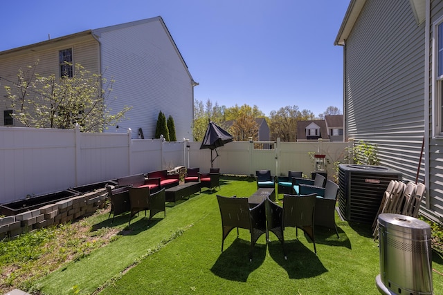 view of yard with central air condition unit, an outdoor living space, and a fenced backyard