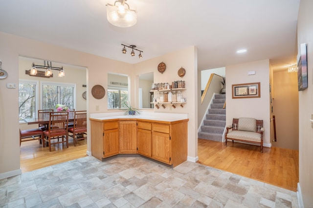 kitchen with light countertops and stone finish floor