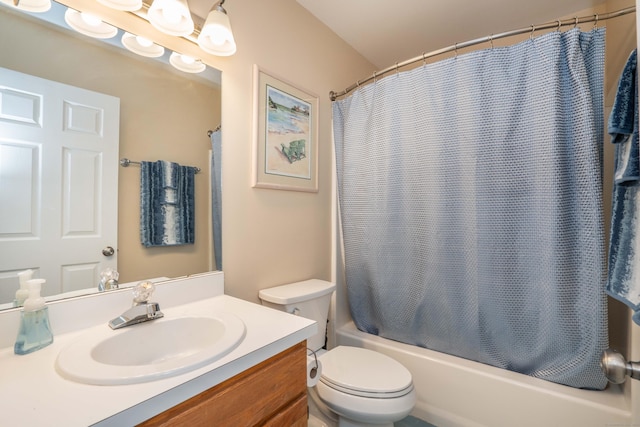 bathroom featuring vanity, shower / tub combo, and toilet