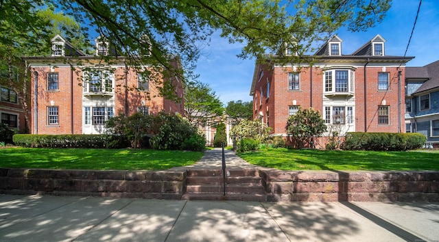 496 Whitney Ave Unit 1C, New Haven, CT 06511 - view of front facade with brick siding and a front yard