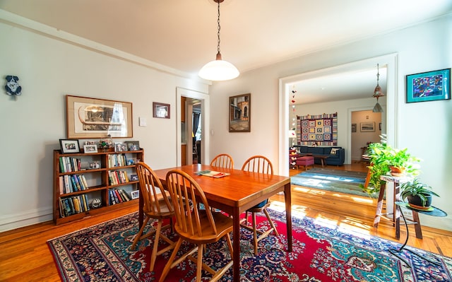 496 Whitney Ave Unit 1C, New Haven, CT 06511 - dining space featuring ornamental molding and wood finished floors