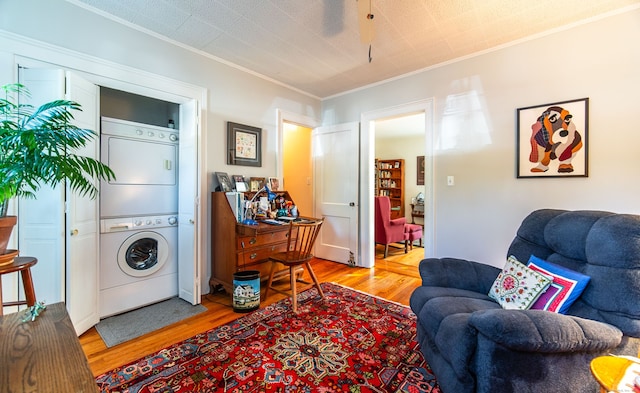 496 Whitney Ave Unit 1C, New Haven, CT 06511 - interior space with stacked washer / dryer, crown molding, light wood-style flooring, and laundry area