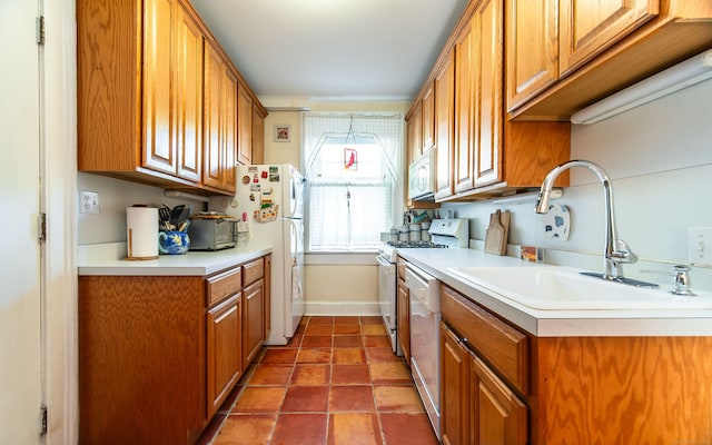 496 Whitney Ave Unit 1C, New Haven, CT 06511 - kitchen featuring a sink, white appliances, brown cabinets, tile patterned floors, and light countertops