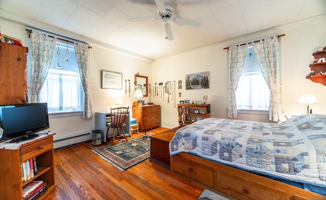 496 Whitney Ave Unit 1C, New Haven, CT 06511 - bedroom with a ceiling fan, a baseboard radiator, and wood-type flooring