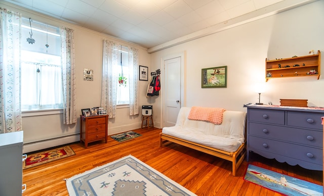 496 Whitney Ave Unit 1C, New Haven, CT 06511 - living area with wood finished floors and a baseboard heating unit