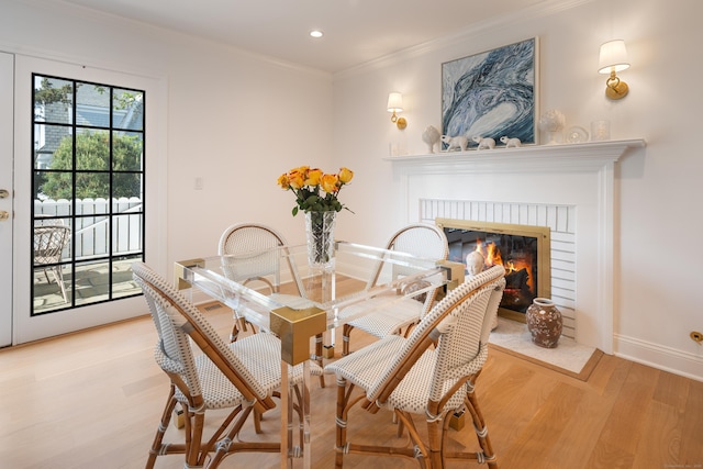 1 Maple St Unit 1, New Canaan, CT 06840 - dining room featuring ornamental molding, recessed lighting, a fireplace, light wood-style flooring, and baseboards