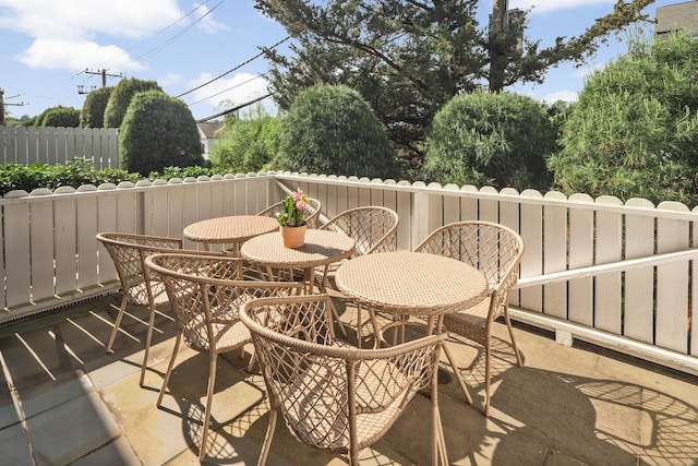 1 Maple St Unit 1, New Canaan, CT 06840 - view of patio featuring fence and outdoor dining space