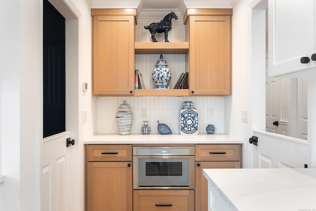 1 Maple St Unit 1, New Canaan, CT 06840 - bar with ornamental molding, stainless steel oven, and decorative backsplash