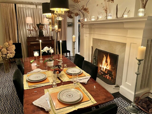 dining area with a high end fireplace