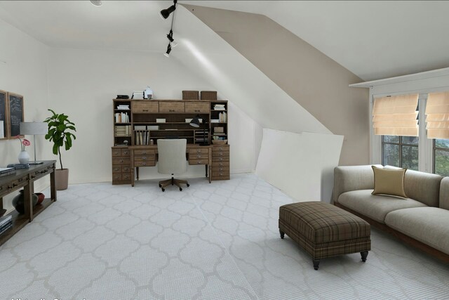 carpeted home office featuring vaulted ceiling and track lighting