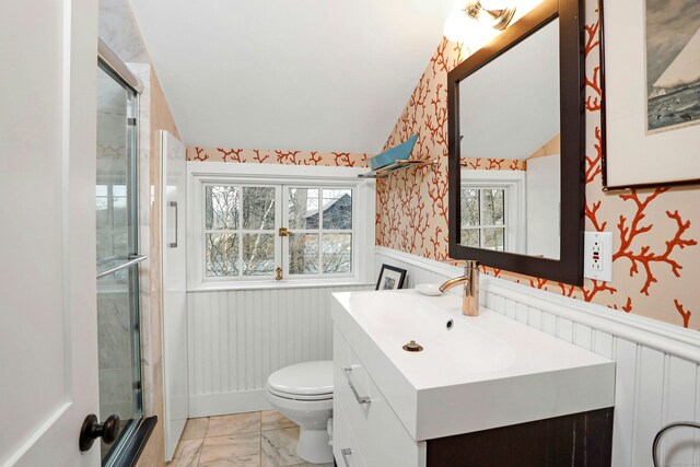 bathroom with marble finish floor, a wainscoted wall, a healthy amount of sunlight, and wallpapered walls