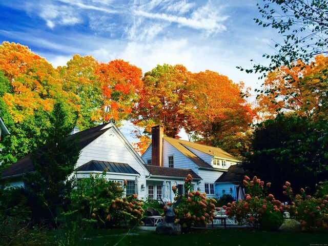 back of property with a standing seam roof