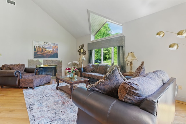17 Pasture Ln, Glastonbury, CT 06073 - living room featuring high vaulted ceiling, wood finished floors, and a premium fireplace
