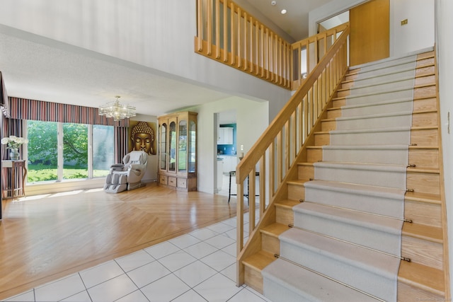 17 Pasture Ln, Glastonbury, CT 06073 - staircase with a chandelier and a towering ceiling