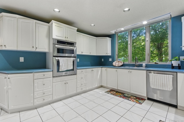 17 Pasture Ln, Glastonbury, CT 06073 - kitchen featuring stainless steel appliances, a sink, white cabinets, and recessed lighting