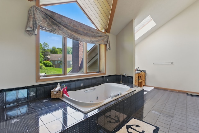 17 Pasture Ln, Glastonbury, CT 06073 - bathroom featuring lofted ceiling, a skylight, tile patterned flooring, and a tub with jets