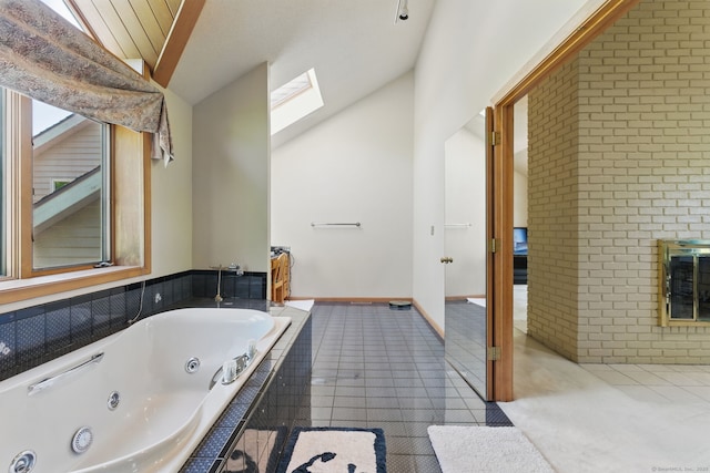 17 Pasture Ln, Glastonbury, CT 06073 - full bathroom featuring lofted ceiling, a skylight, a jetted tub, and brick wall