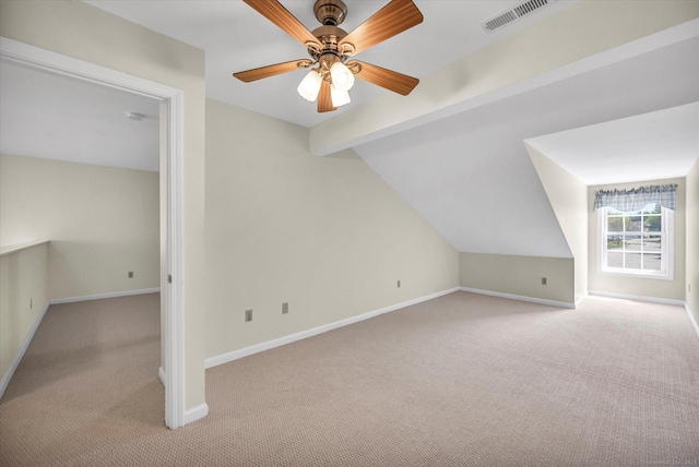 bonus room with light carpet, baseboards, and ceiling fan