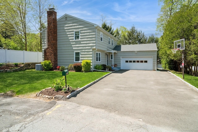 35 Hampton Ln, Stamford, CT 06903 - view of front of property with a garage, driveway, and a chimney