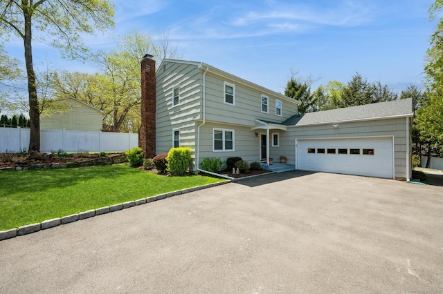 35 Hampton Ln, Stamford, CT 06903 - view of front of home featuring asphalt driveway, an attached garage, and a chimney