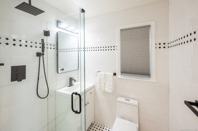 35 Hampton Ln, Stamford, CT 06903 - bathroom with tile walls, a shower stall, toilet, and vanity