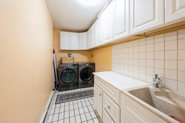 35 Hampton Ln, Stamford, CT 06903 - washroom featuring cabinet space, washer and dryer, light tile patterned flooring, baseboards, and baseboard heating