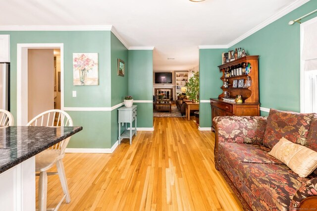 35 Hampton Ln, Stamford, CT 06903 - living room with light wood-style flooring, ornamental molding, baseboards, and a fireplace
