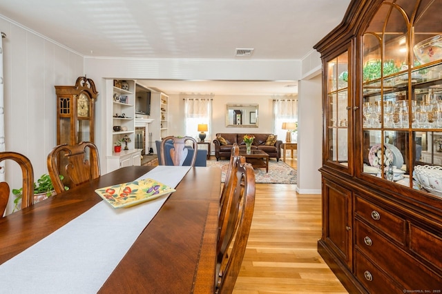 35 Hampton Ln, Stamford, CT 06903 - dining space with light wood-style floors and crown molding