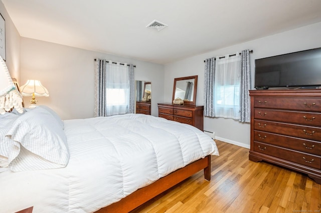 35 Hampton Ln, Stamford, CT 06903 - bedroom featuring light wood-style flooring, a baseboard heating unit, and baseboards