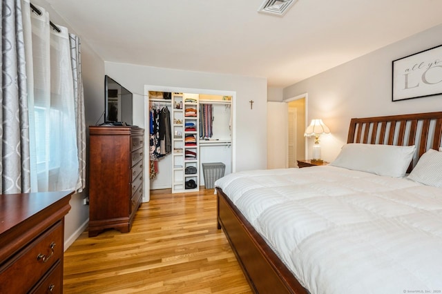 35 Hampton Ln, Stamford, CT 06903 - bedroom featuring light wood-type flooring, a closet, and a walk in closet