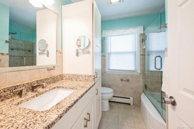 35 Hampton Ln, Stamford, CT 06903 - bathroom with a baseboard radiator, tile walls, tile patterned flooring, vanity, and toilet